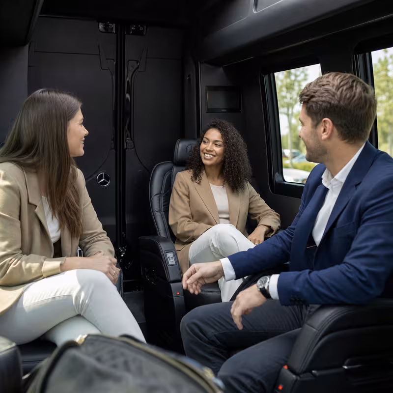 Group boarding a white charter bus for Corporate Transportation transportation in Bronx