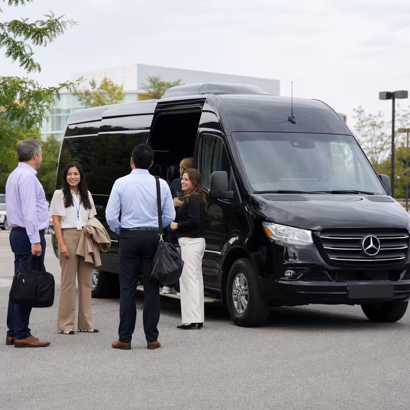 Party bus interior with wraparound leather seating and LED lighting in Bronx