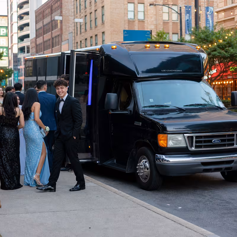 Passengers loading luggage while boarding an Bronx group shuttle