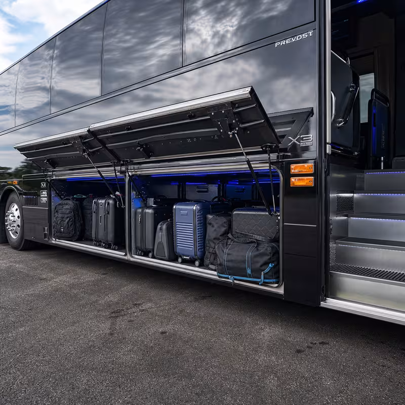 Party bus interior with wraparound leather seating and LED lighting in Bronx