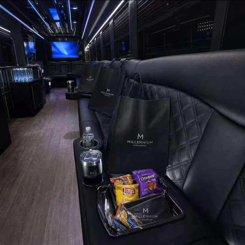Party bus interior with wraparound leather seating and LED lighting in Bronx